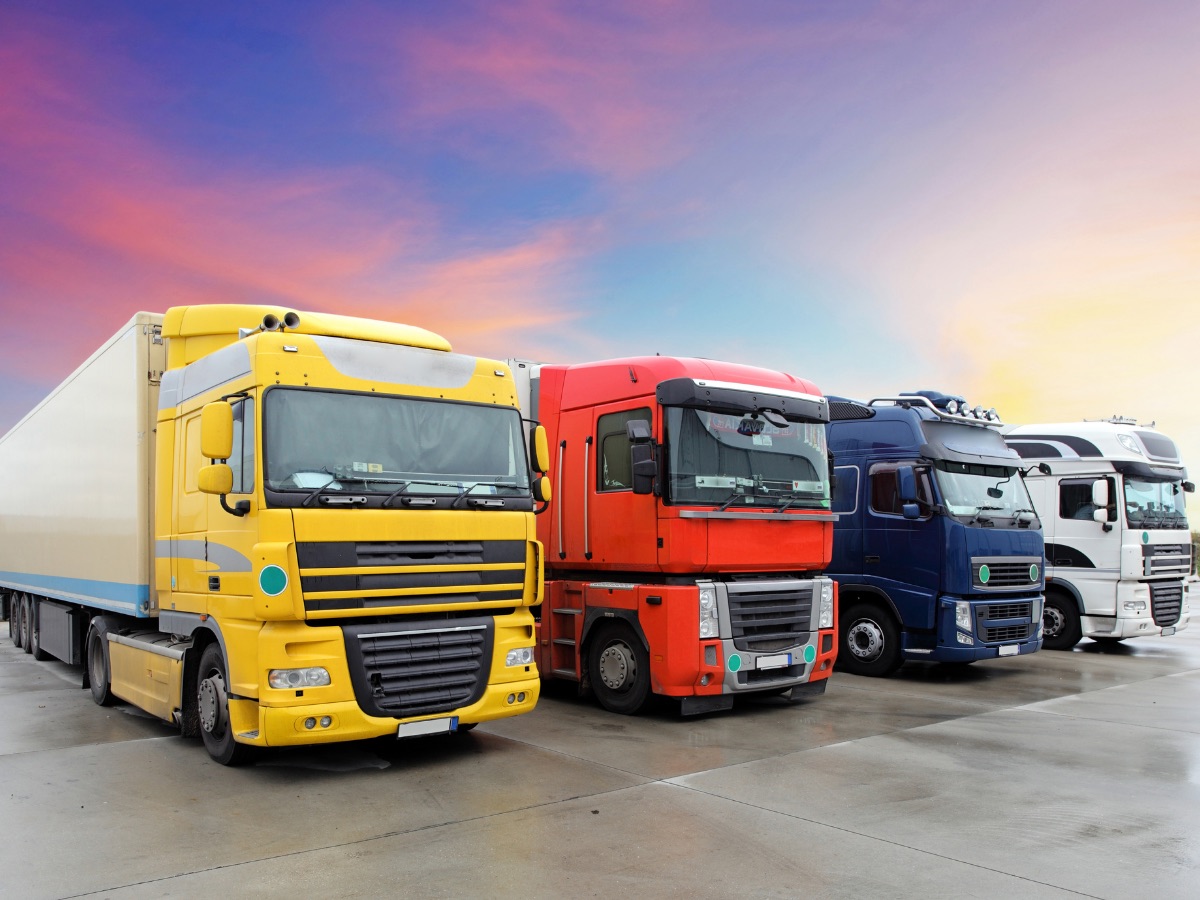 Row of commercial trucks used for fleet and logistics operations