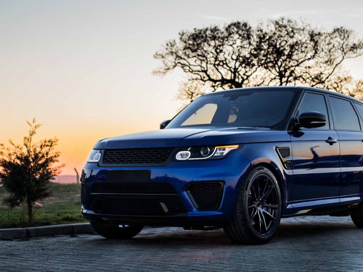 Personal vehicle parked outdoors at sunset